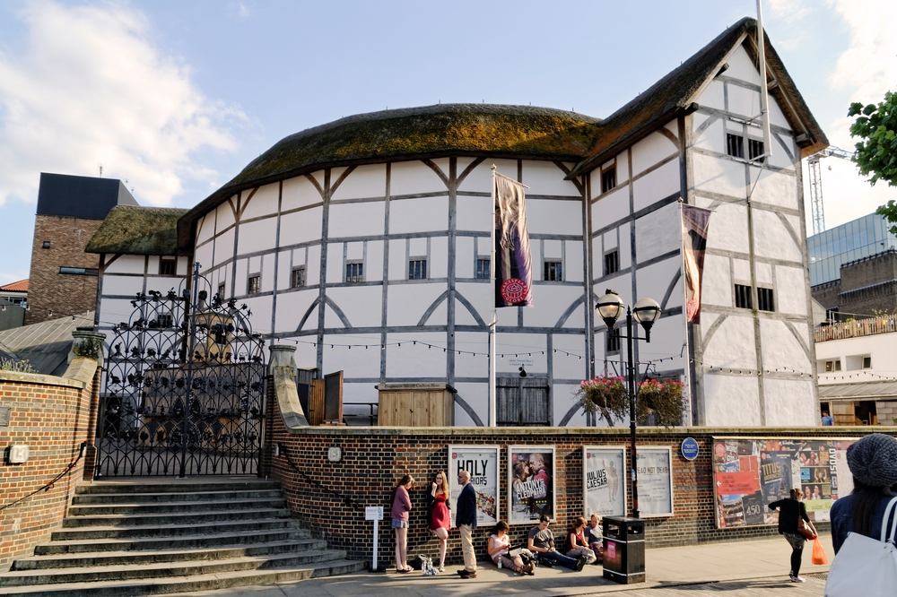 People walking in front of Shakespeare's Globe in London