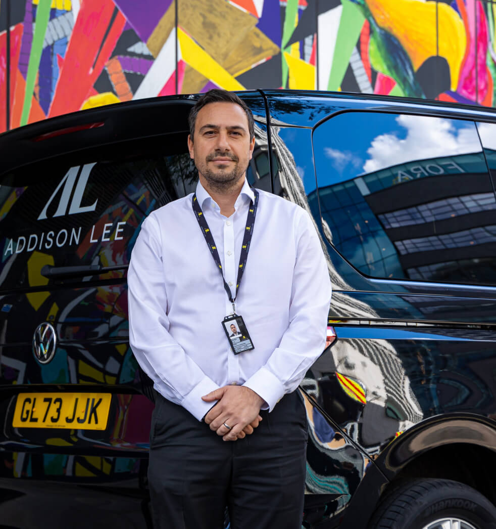 addison lee driver standing in front of car