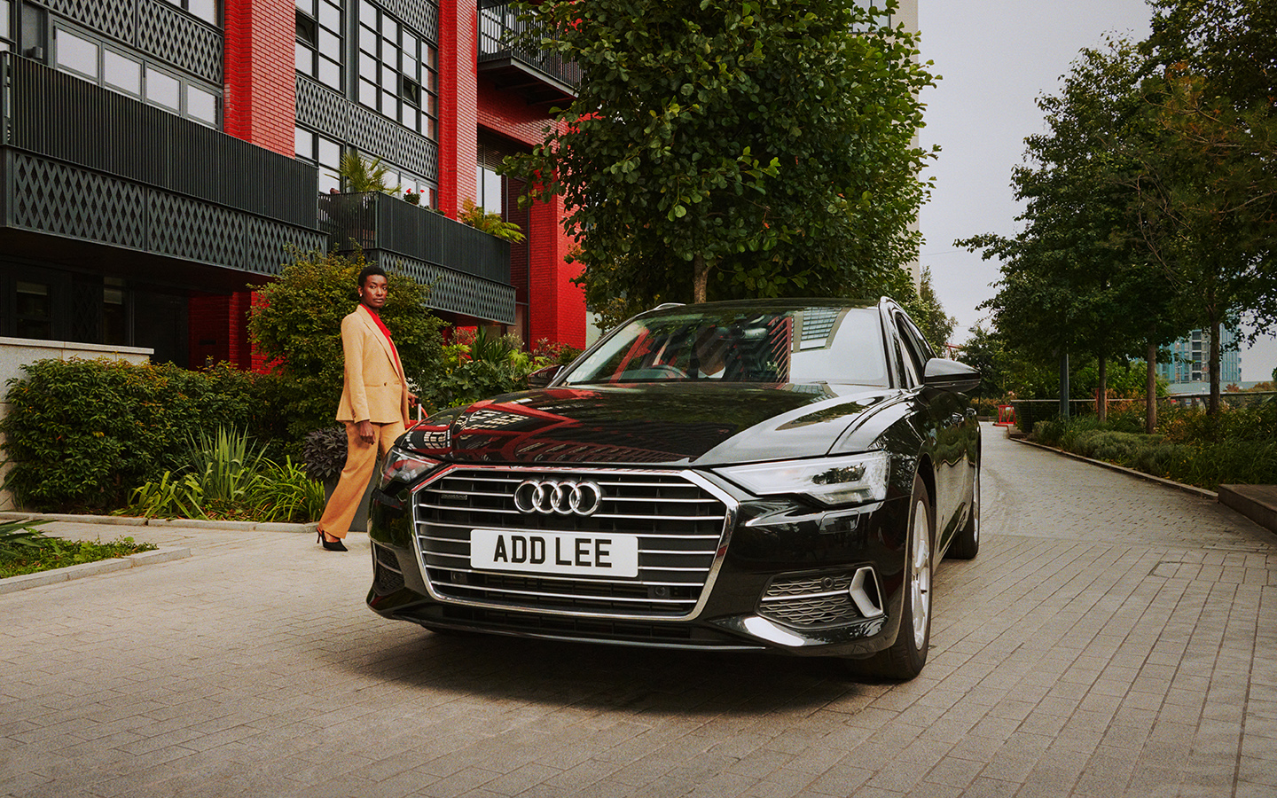 Addison Lee executive Car with woman getting in