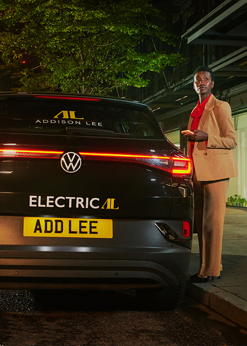 Addison Lee iD4 electric Car with woman in suit