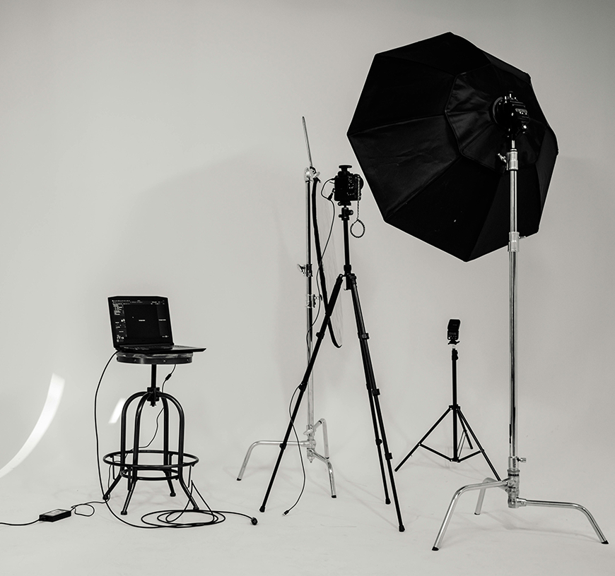 Media production equipment in front of a white screen