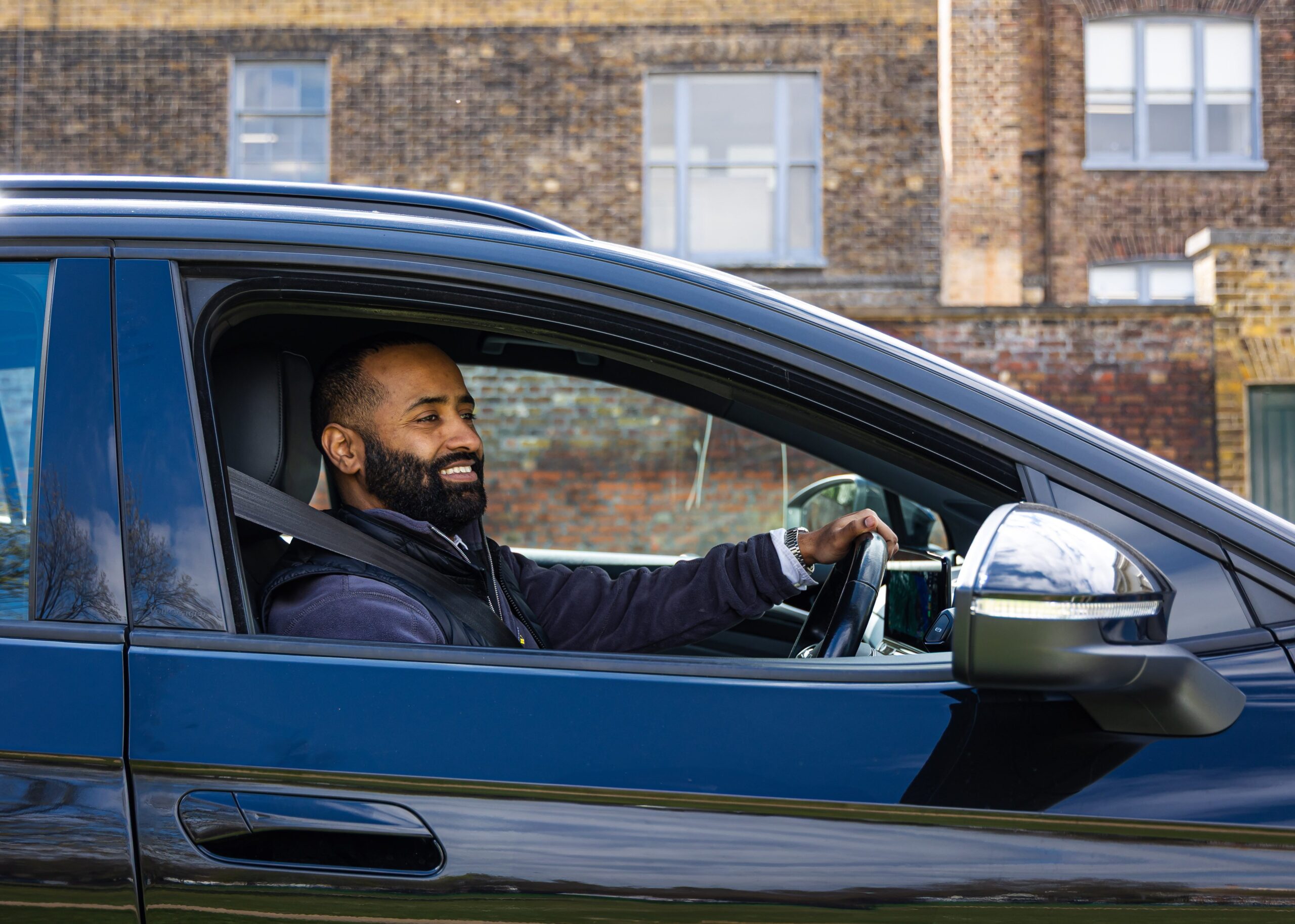 Addison Lee Driver in driving seat