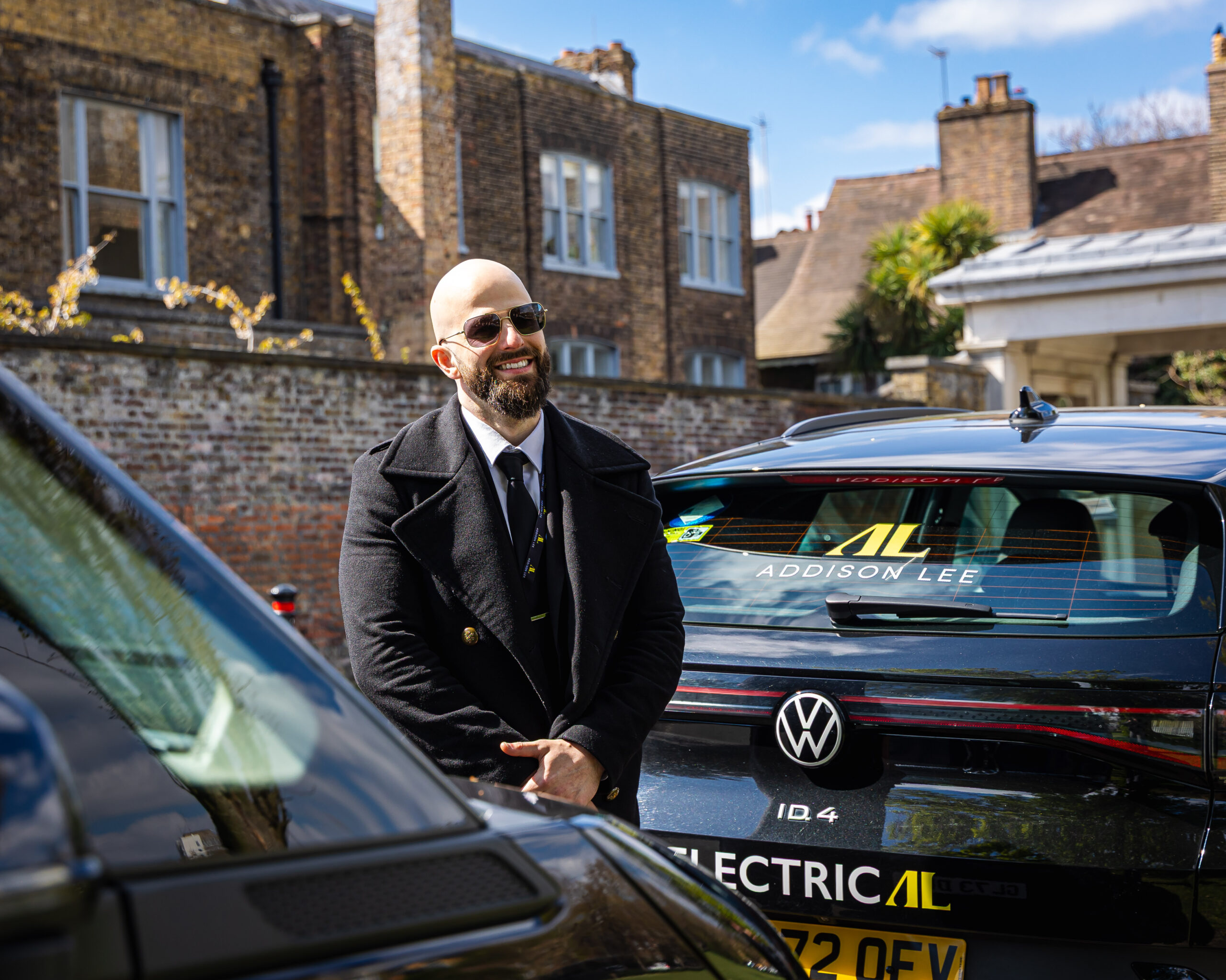 Addison Lee Driver next to VW ID.4