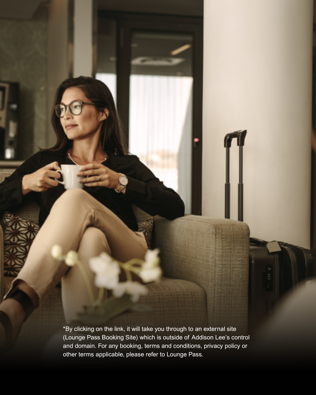 Woman waiting in an airport lounge for her flight.